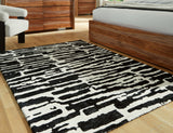 Bramshaw Black/Ivory Medium Rug by Ashley at Eve Furniture
