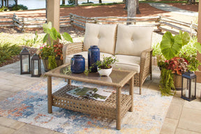 Braylee Driftwood Outdoor Loveseat with Table by Ashley at Eve Furniture