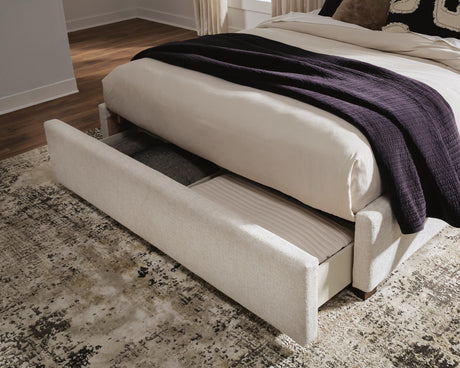 Brizmore Beige Queen Upholstered Storage Bed by Ashley at Eve Furniture