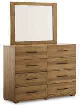 Dakmore King Upholstered Bed with Mirrored Dresser and Chest in Brown