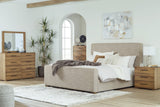 Dakmore King Upholstered Bed with Mirrored Dresser, Chest and Nightstand in Brown