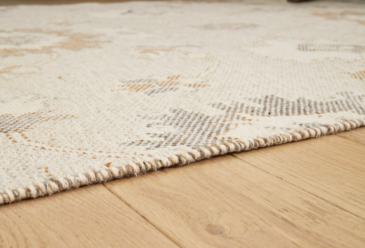 Calkin Linen/Gray/Caramel 5' x 7' Rug by Ashley at Eve Furniture