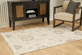 Calkin Linen/Gray/Caramel 5' x 7' Rug by Ashley at Eve Furniture