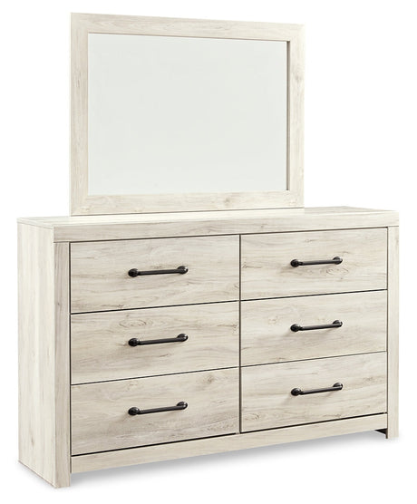 Cambeck King/California King Upholstered Panel Headboard with Mirrored Dresser, Chest and Nightstand in Whitewash