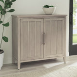 Camden Two Door Two Drawer Bar Cabinet with Stemware Rack and Wine Rack in Chai by Modus Furniture at Eve Furniture