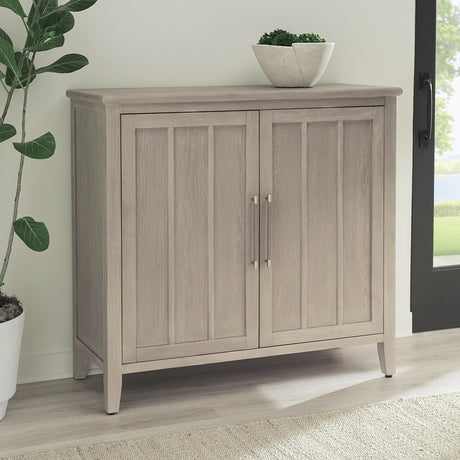Camden Two Door Two Drawer Bar Cabinet with Stemware Rack and Wine Rack in Chai by Modus Furniture at Eve Furniture