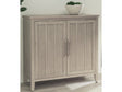 Camden Two Door Two Drawer Bar Cabinet with Stemware Rack and Wine Rack in Chai by Modus Furniture at Eve Furniture