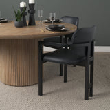 Carlisle Curved Back Black Leather Tripod Frame Dining Armchair by Mercana at Eve Furniture