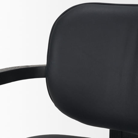 Carlisle Curved Back Black Leather Tripod Frame Dining Armchair by Mercana at Eve Furniture