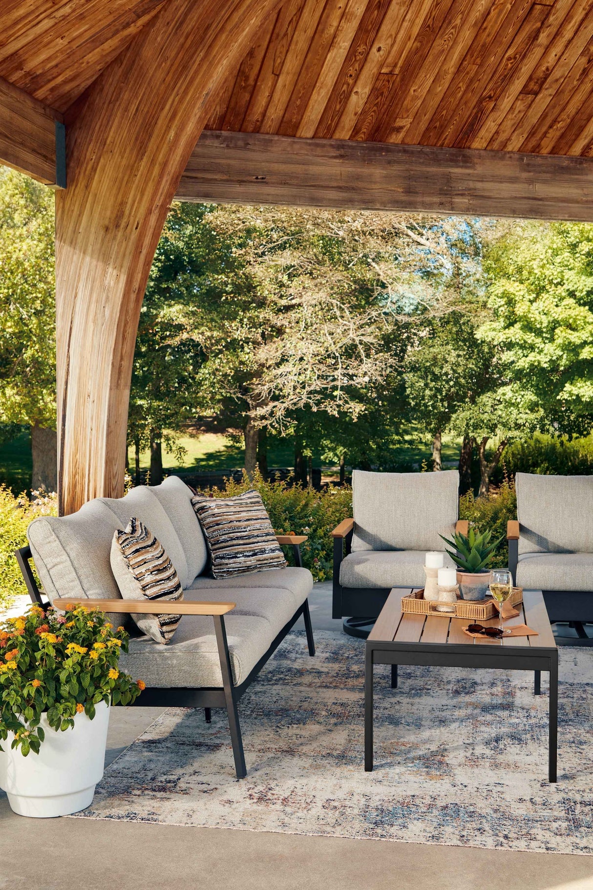 Carmel Highlands Dark Brown Outdoor Sofa,Chairs,Table (Set of 4) by Ashley at Eve Furniture