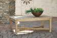 Carter Hall Beige Outdoor Coffee Table by Ashley at Eve Furniture