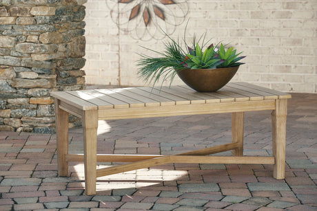 Carter Hall Beige Outdoor Coffee Table by Ashley at Eve Furniture