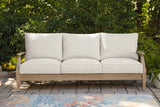 Carter Hall Beige Outdoor Sofa with Cushion by Ashley at Eve Furniture