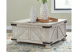 Carynhurst Whitewash Coffee Table by Ashley at Eve Furniture