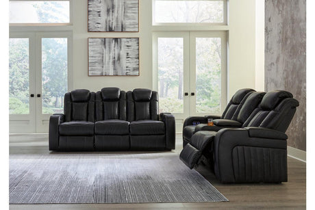 Caveman Den Midnight Dual Power Reclining Sofa and Loveseat by Ashley at Eve Furniture
