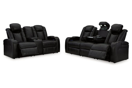 Caveman Den Midnight Dual Power Reclining Sofa and Loveseat by Ashley at Eve Furniture