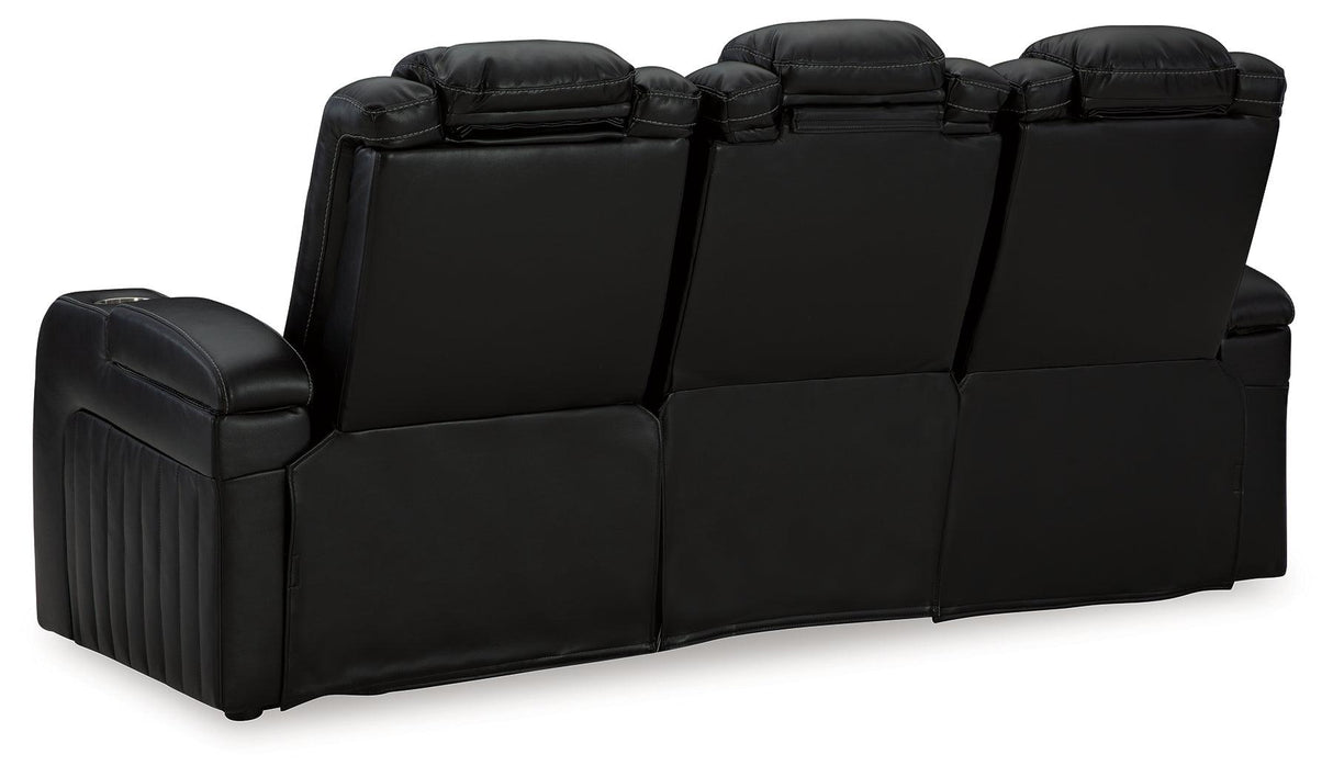 Caveman Den Midnight Dual Power Reclining Sofa by Ashley at Eve Furniture
