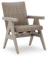 Cliff Trails Beige Outdoor Rocking Arm Chair by Ashley at Eve Furniture