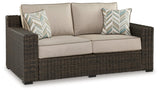 Coastline Bay Brown Outdoor Loveseat with Cushion by Ashley at Eve Furniture