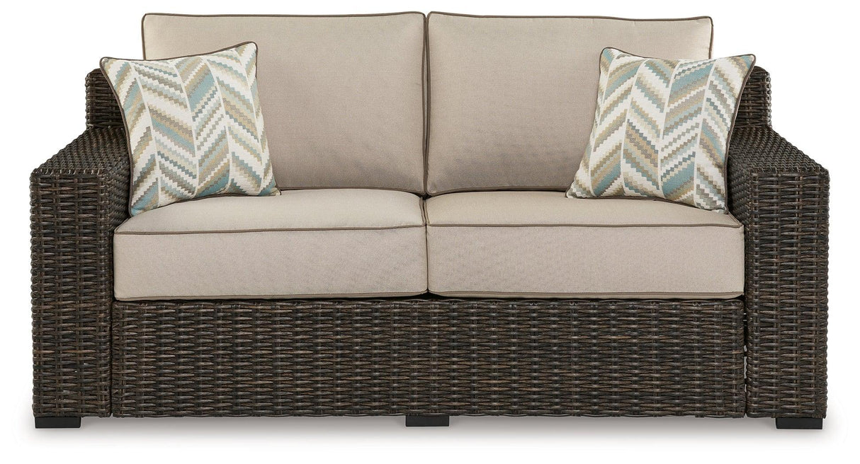 Coastline Bay Brown Outdoor Loveseat with Cushion by Ashley at Eve Furniture
