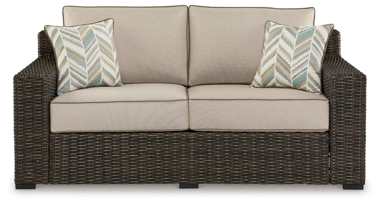 Coastline Bay Brown Outdoor Loveseat with Cushion by Ashley at Eve Furniture