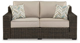 Coastline Bay Brown Outdoor Loveseat with Cushion by Ashley at Eve Furniture