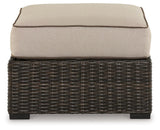 Coastline Bay Brown Outdoor Ottoman with Cushion by Ashley at Eve Furniture