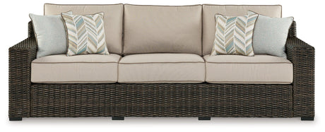 Coastline Bay Brown Outdoor Sofa with Cushion by Ashley at Eve Furniture