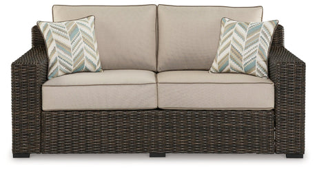 Coastline Bay Brown Outdoor Loveseat with Cushion by Ashley at Eve Furniture