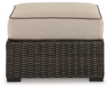 Coastline Bay Brown Outdoor Ottoman with Cushion by Ashley at Eve Furniture