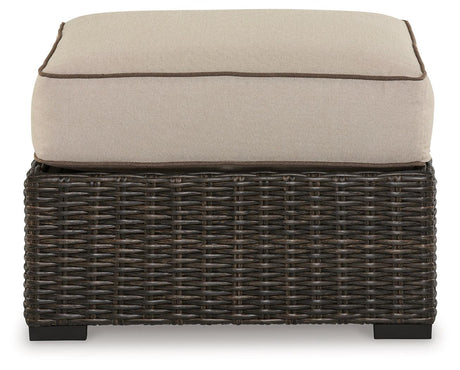 Coastline Bay Brown Outdoor Ottoman with Cushion by Ashley at Eve Furniture