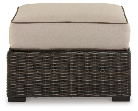 Coastline Bay Brown Outdoor Ottoman with Cushion by Ashley at Eve Furniture