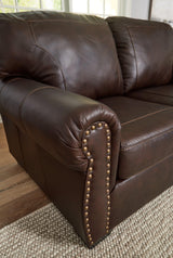Colleton Dark Brown Leather Sofa by Ashley at Eve Furniture