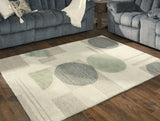 Dallane Linen/Blue/Green 5' x 7' Rug by Ashley at Eve Furniture
