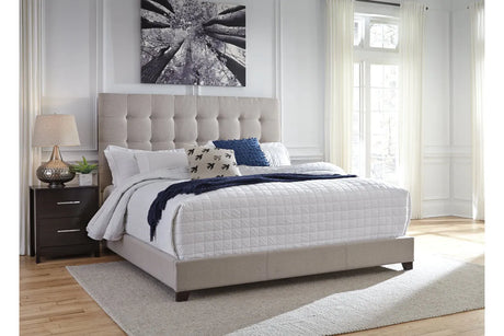 Dolante Beige King Upholstered Bed by Ashley at Eve Furniture