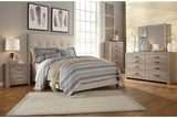 Dolante Beige Queen Upholstered Bed by Ashley at Eve Furniture