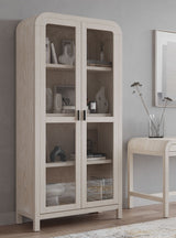 Drake Glass Door Wooden Bookcase in Sugar by Modus Furniture at Eve Furniture