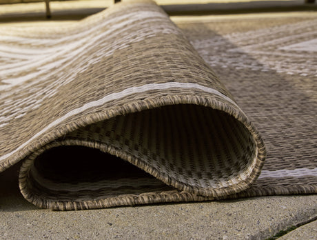 Dunsler Brown/Cream 5' x 7' Rug by Ashley at Eve Furniture