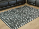 Elderland Black/Gray Washable Medium Rug by ASHLEY FURNITURE at Eve Furniture