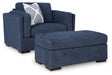 Evansley Chair and Ottoman in Navy by Ashley at Eve Furniture
