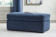 Evansley Navy Ottoman by Ashley at Eve Furniture