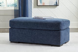 Evansley Navy Ottoman by Ashley at Eve Furniture