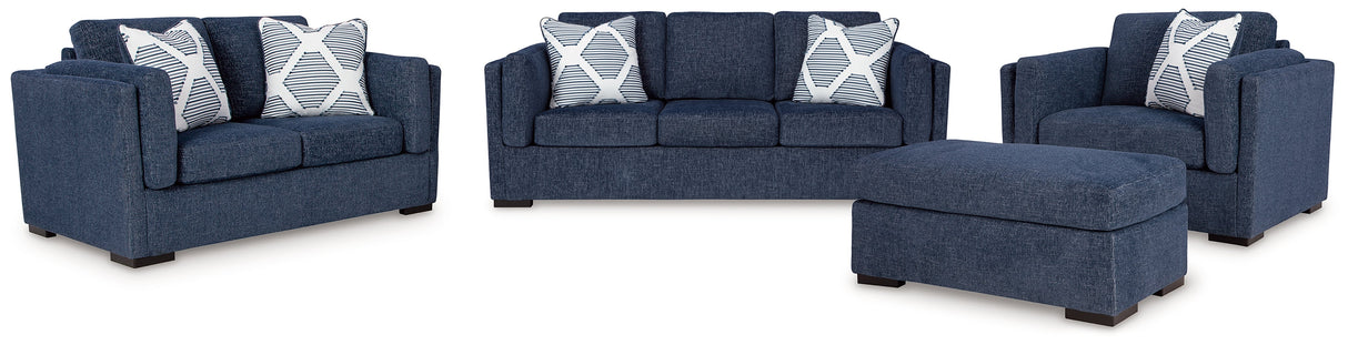 Evansley Sofa, Loveseat, Chair and Ottoman in Navy by Ashley at Eve Furniture