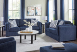 Evansley Sofa, Loveseat, Chair and Ottoman in Navy by Ashley at Eve Furniture
