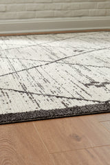 Fenriston Cream/Black Medium Rug by Ashley at Eve Furniture