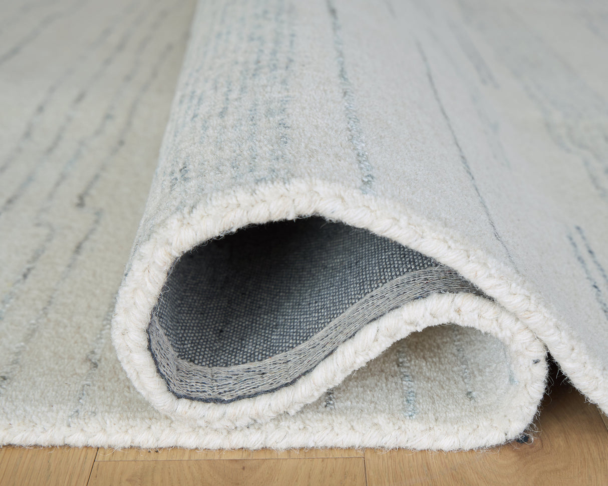 Genemost Ivory/Blue Large Rug by ASHLEY FURNITURE at Eve Furniture