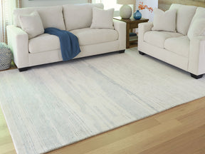 Genemost Ivory/Blue Large Rug by ASHLEY FURNITURE at Eve Furniture