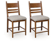 Greddinton Brown Upholstered Barstool (Set of 2) by Ashley at Eve Furniture