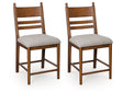 Greddinton Brown Upholstered Barstool (Set of 2) by Ashley at Eve Furniture