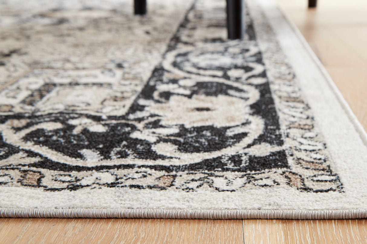 Gregmoore Multi 5'2" x 6'10" Rug by ASHLEY FURNITURE at Eve Furniture